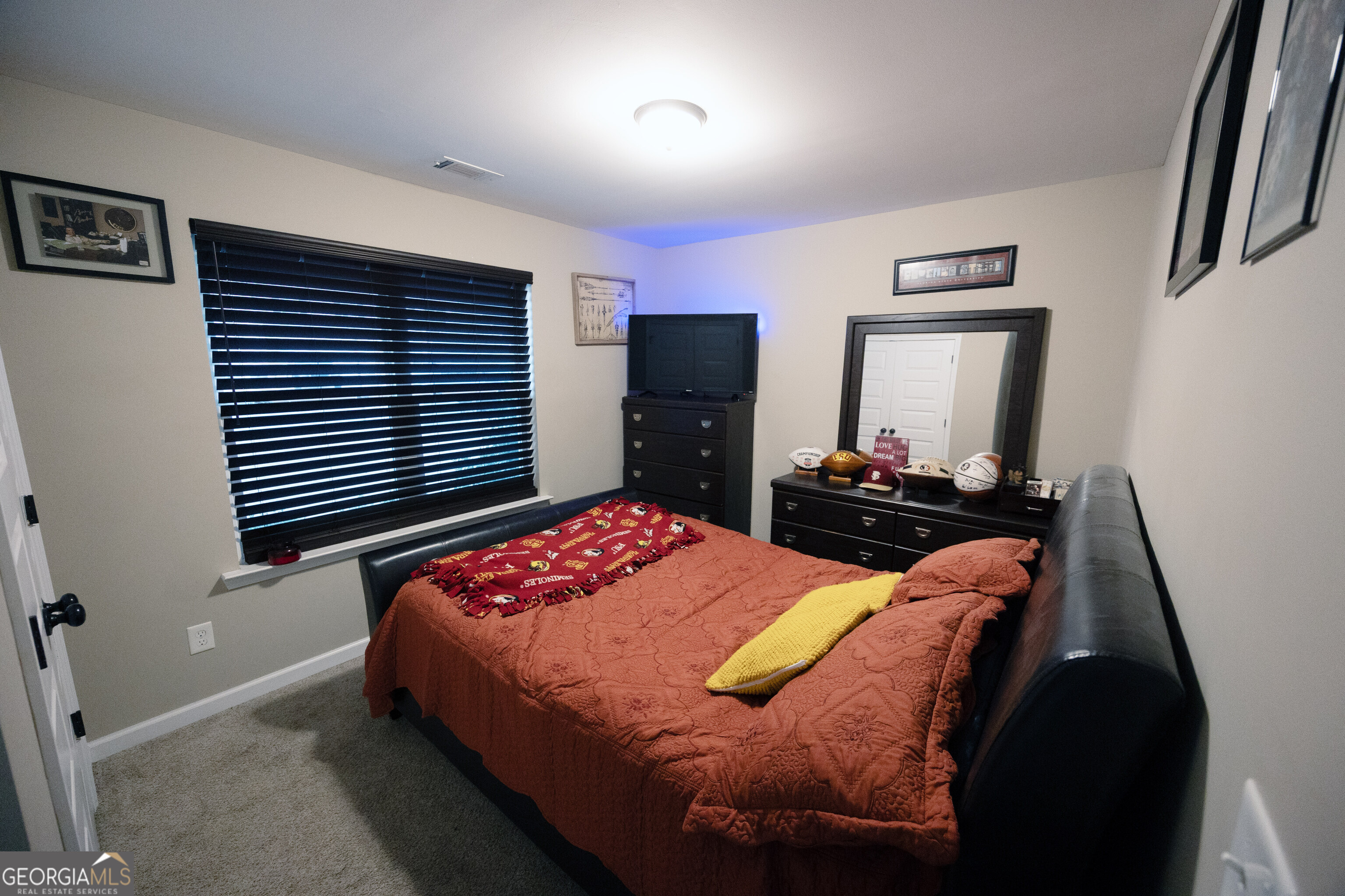 104 Savannah Way Milner, GA 30257 - Photo 7 of 27 a bedroom with a bed and a dresser