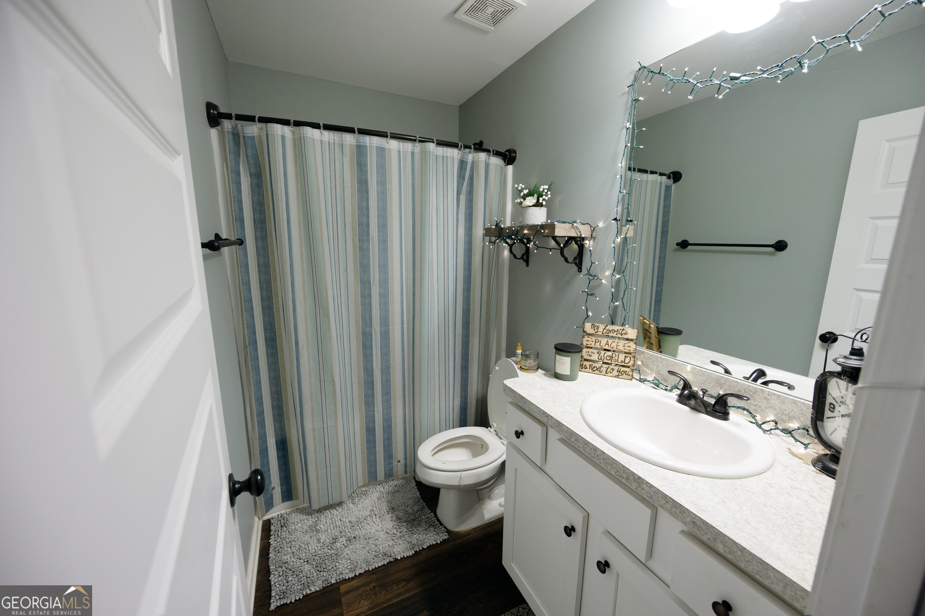 104 Savannah Way Milner, GA 30257 - Photo 10 of 27 a bathroom with a granite countertop sink toilet and shower