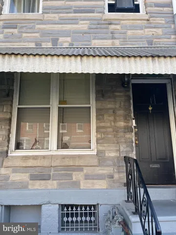 a view of wooden door and chair