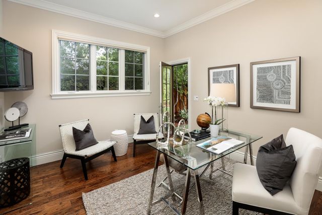 a work room with furniture and wooden floor