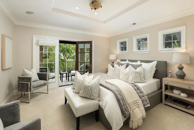 a spacious bedroom with a bed and a couch