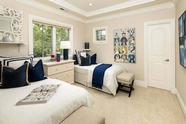 a bedroom with a bed and a table