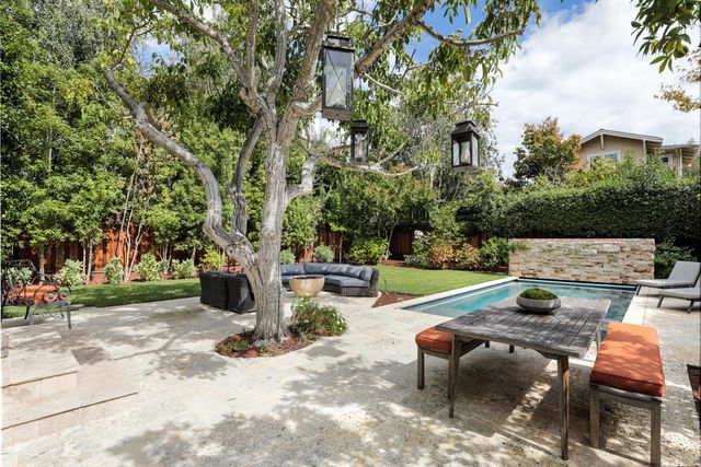 a view of a yard with furniture