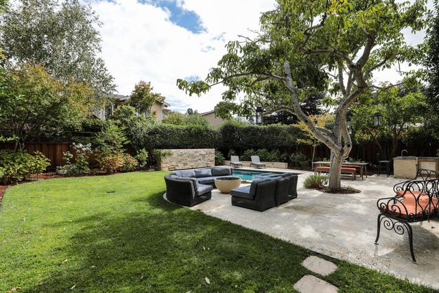 a view of a sitting area with furniture and garden