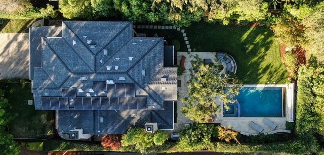 a aerial view of a house with a yard