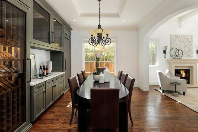a view of a a dining room with furniture window and wooden floor