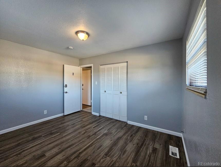5542 Scranton Street Denver, CO 80239 - Photo 14 of 36 a view of room with window
