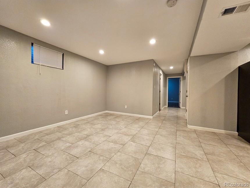 5542 Scranton Street Denver, CO 80239 - Photo 27 of 36 a view of an empty room