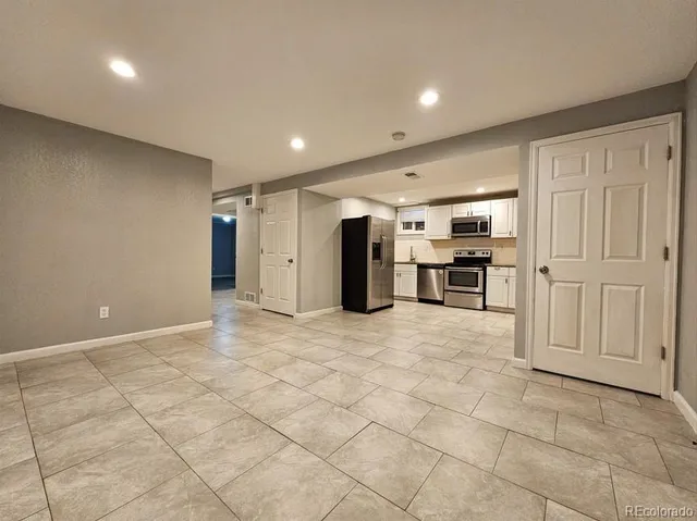 a view of a electric appliances in kitchen and empty room