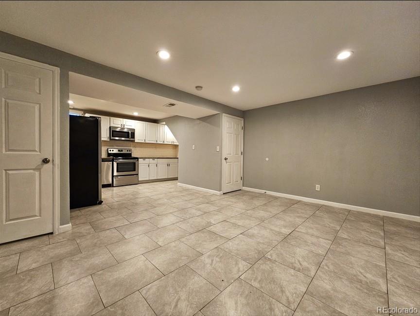 5542 Scranton Street Denver, CO 80239 - Photo 30 of 36 a view of an empty room