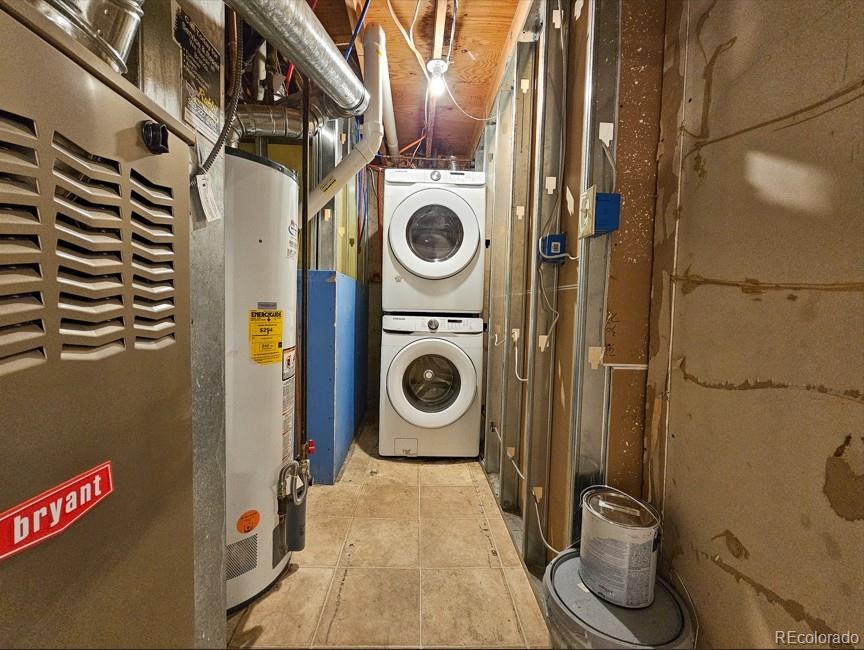5542 Scranton Street Denver, CO 80239 - Photo 31 of 36 a utility room with dryer and washer