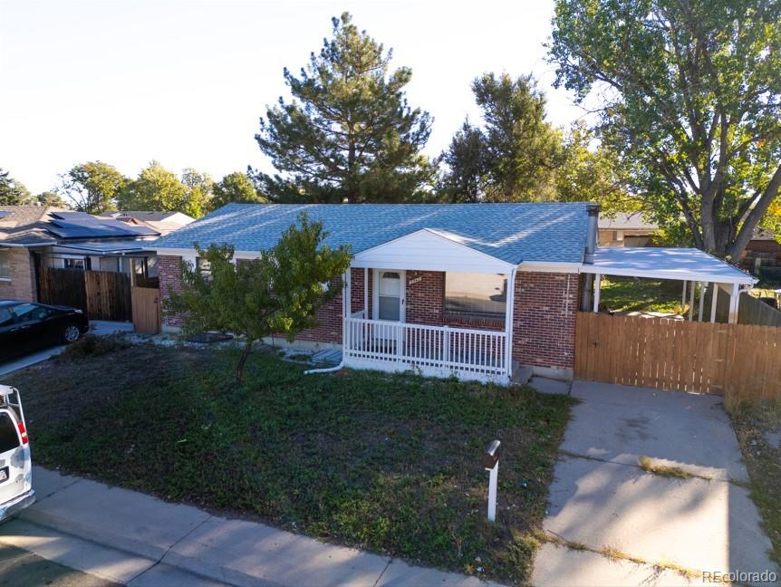 5542 Scranton Street Denver, CO 80239 - Photo 36 of 36 a view of house with garden