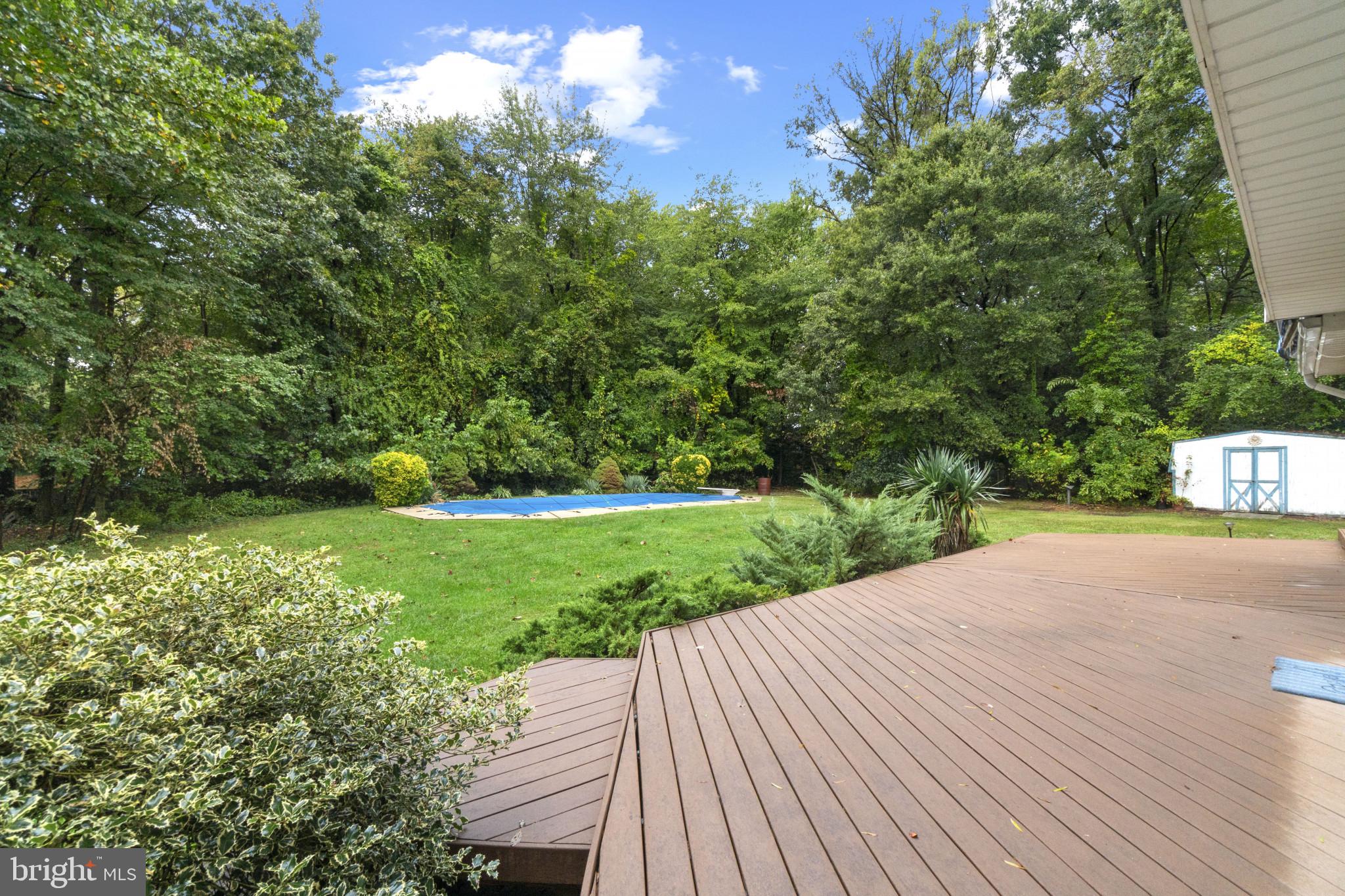 7906 Whites Cove Road Pasadena, MD 21122 - Photo 28 of 40 Wooden terrace featuring a yard