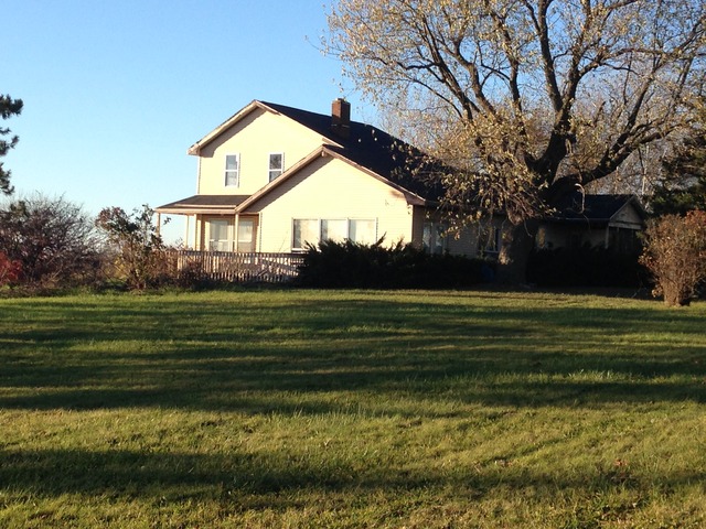 1028 East Delite Inn Road Beecher, IL 60401 - Photo 1 of 11 a front view of a house with a garden
