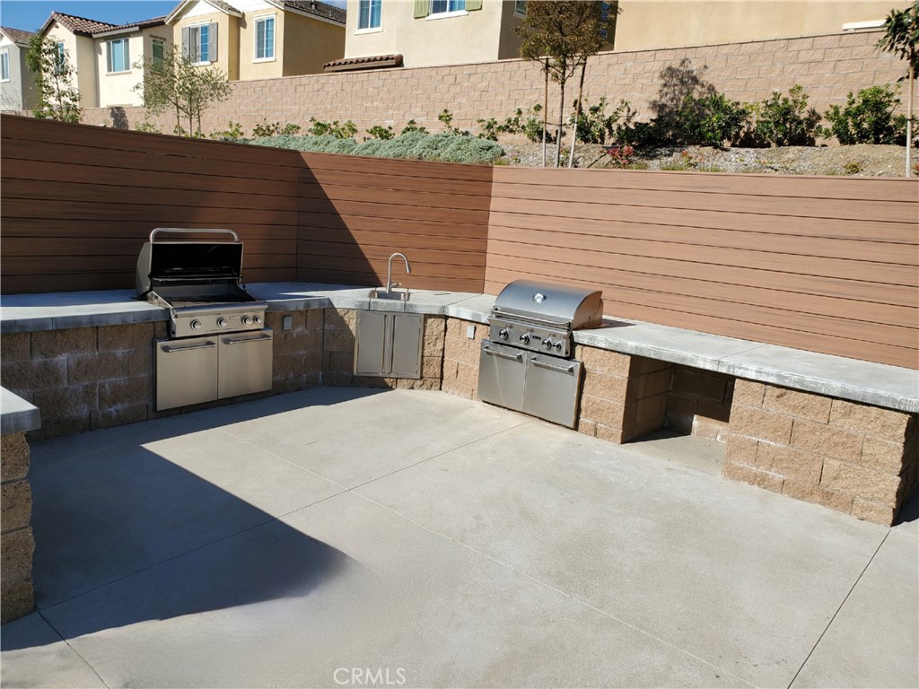 16229 Castello Lane, Unit 6 Fontana, CA 92336 - Photo 31 of 36 Community BBQ area