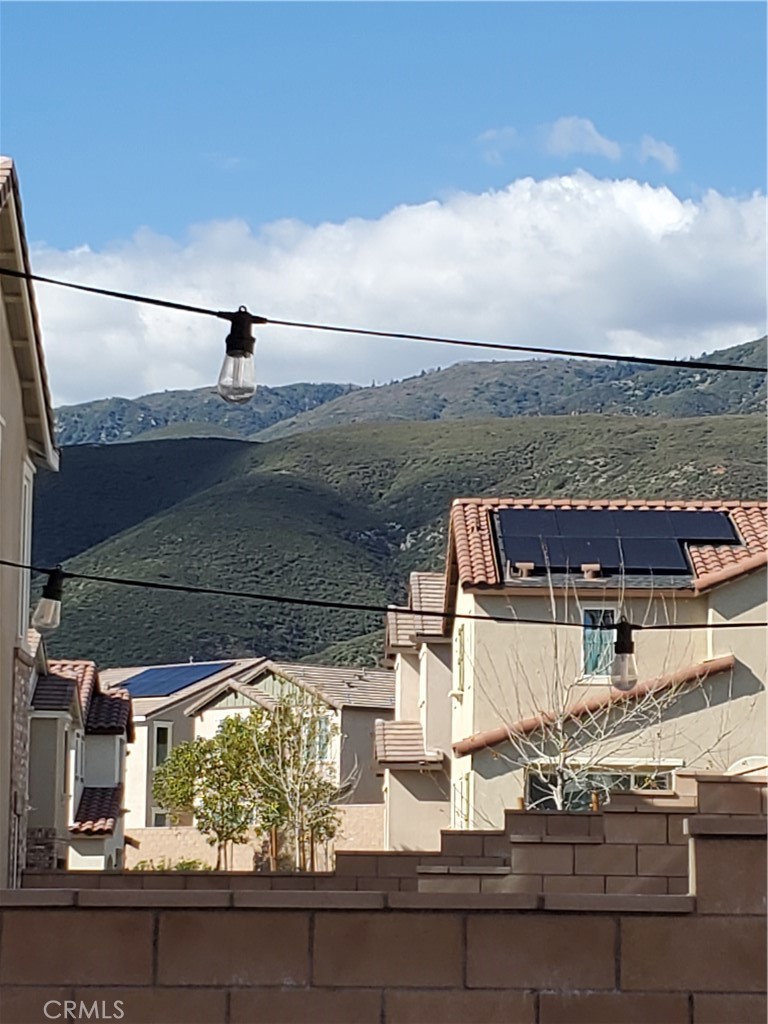 16229 Castello Lane, Unit 6 Fontana, CA 92336 - Photo 36 of 36 Beautiful Mountain Views through the party lights in the backyard