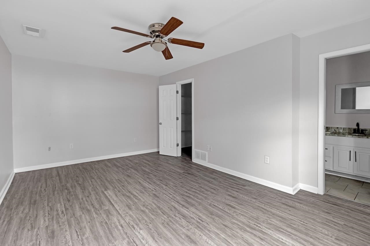 4251 Riviera Drive Memphis, TN 38108 - Photo 11 of 16 a view of a livingroom with wooden floor and a ceiling fan