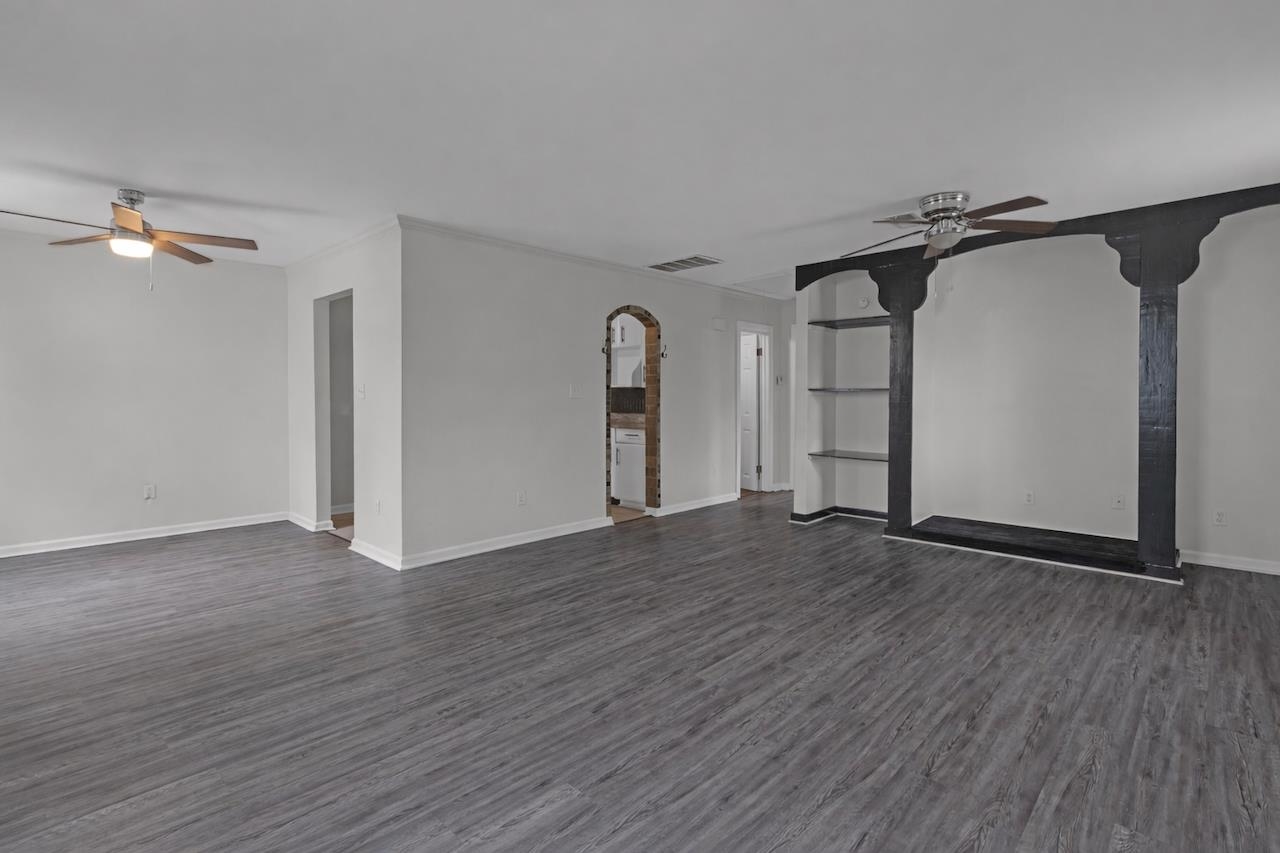4251 Riviera Drive Memphis, TN 38108 - Photo 4 of 16 a view of empty room with wooden floor and fan