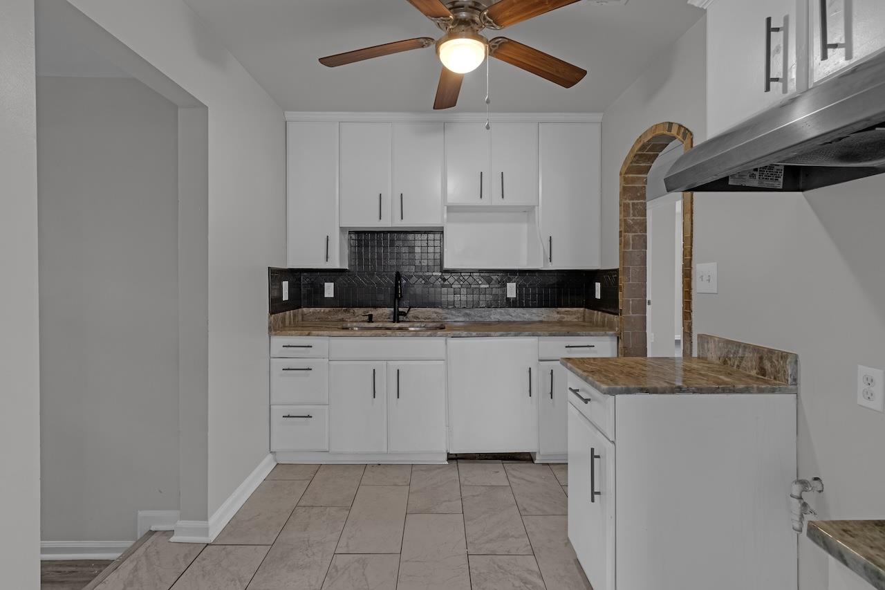 4251 Riviera Drive Memphis, TN 38108 - Photo 8 of 16 a kitchen with stainless steel appliances granite countertop a sink a stove and a refrigerator