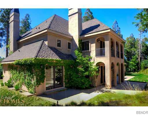 400 Cedar Ridge Drive Lake Arrowhead, CA 92352 - Photo 3 of 8 a view of a house with brick walls and a yard with potted plants