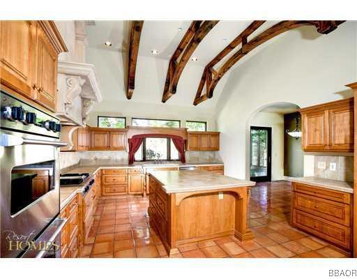 400 Cedar Ridge Drive Lake Arrowhead, CA 92352 - Photo 7 of 8 a kitchen with stainless steel appliances granite countertop a stove and a sink