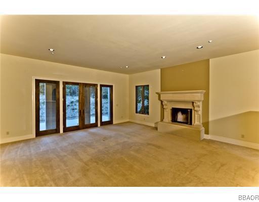 400 Cedar Ridge Drive Lake Arrowhead, CA 92352 - Photo 8 of 8 a view of an empty room with a fireplace