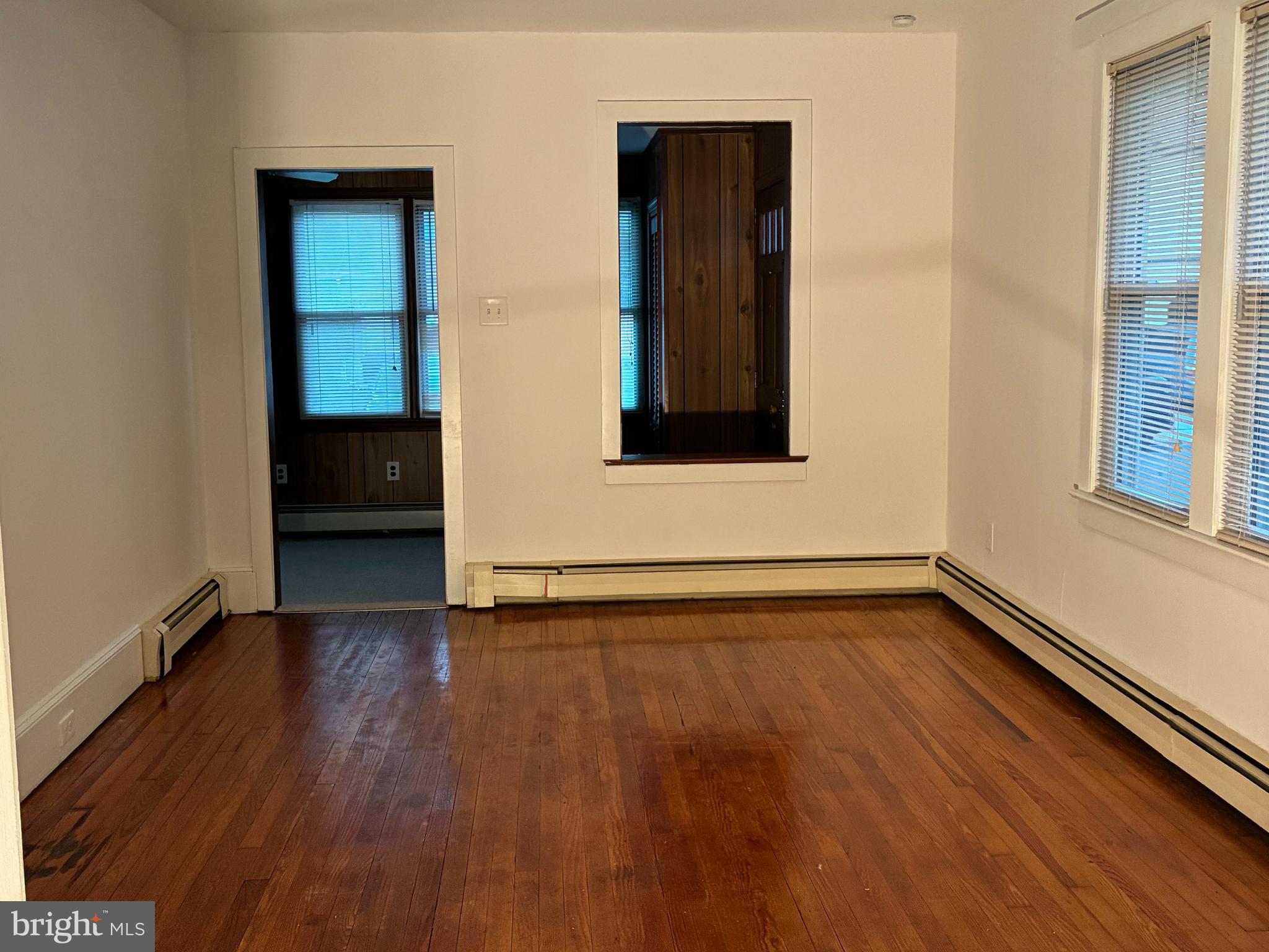 9 Frazier Street Burlington, NJ 08016 - Photo 11 of 33 an empty room with wooden floor and windows