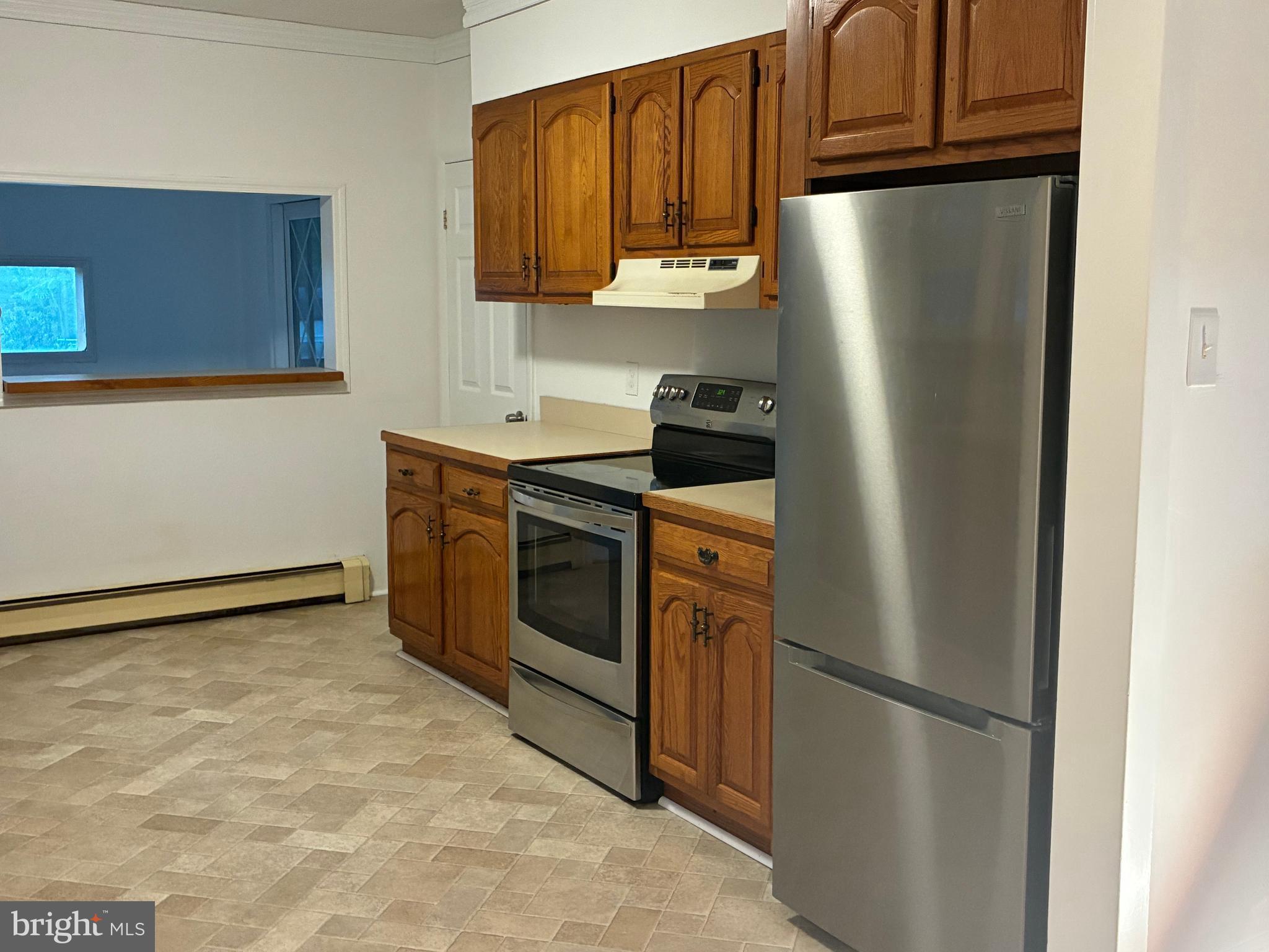 9 Frazier Street Burlington, NJ 08016 - Photo 6 of 33 a kitchen with stainless steel appliances granite countertop a refrigerator a stove a sink and dishwasher