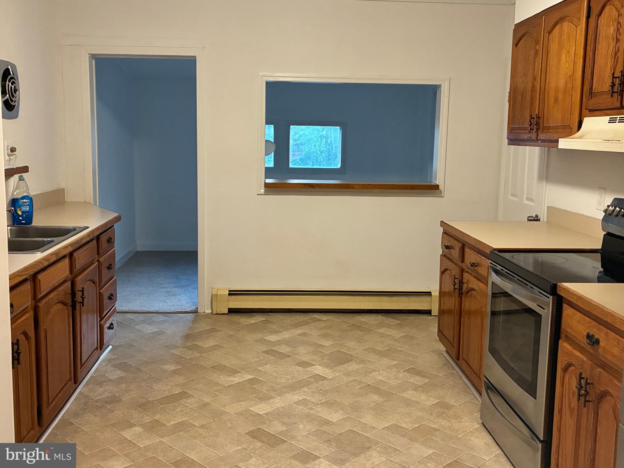 9 Frazier Street Burlington, NJ 08016 - Photo 7 of 33 a kitchen with granite countertop a sink a stove and a refrigerator