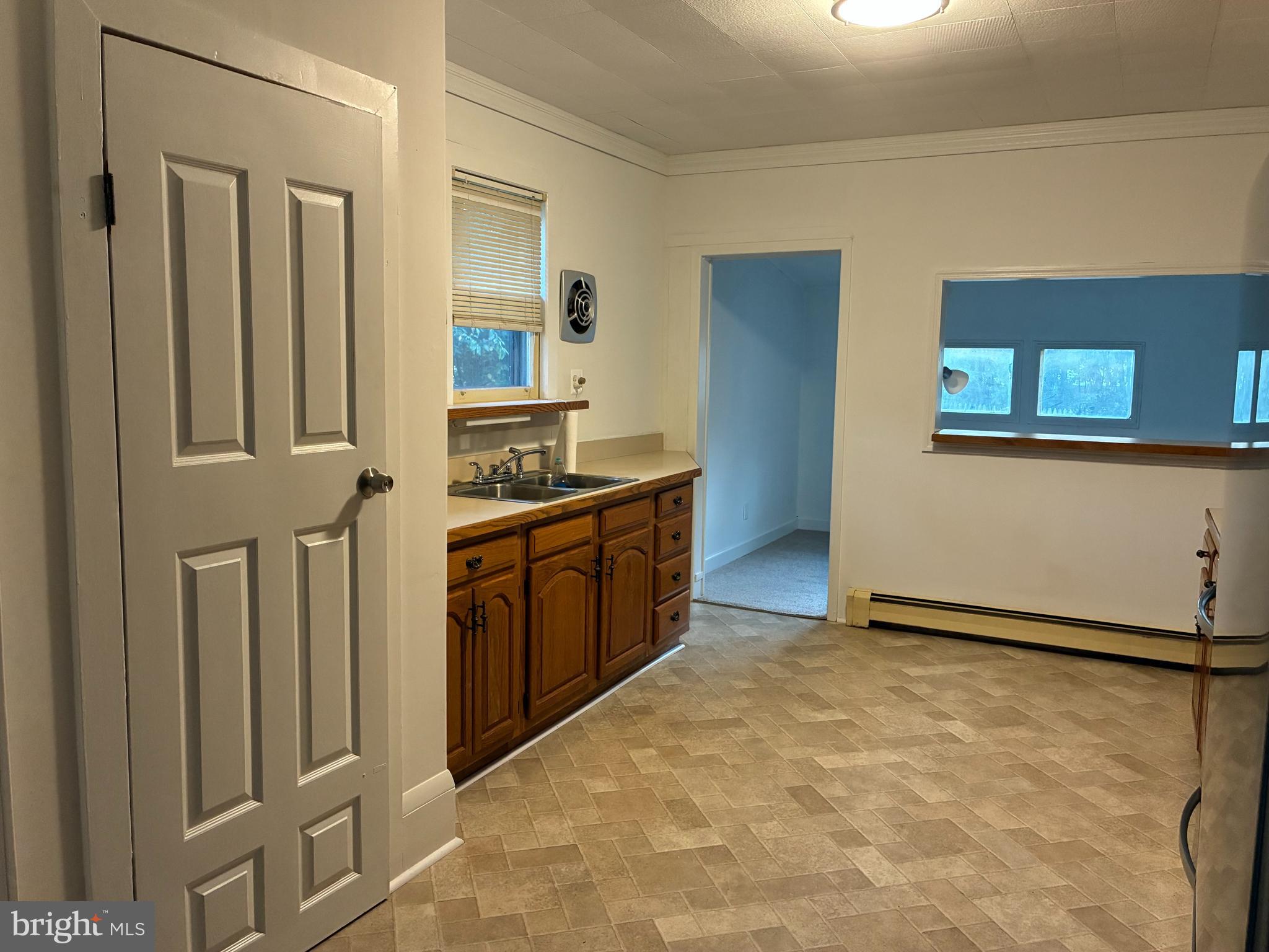 9 Frazier Street Burlington, NJ 08016 - Photo 8 of 33 a kitchen with stainless steel appliances a sink and a refrigerator
