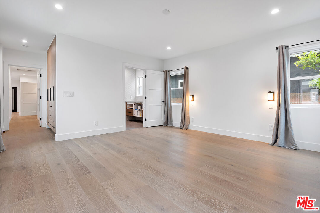 1901 South Point View Street Los Angeles, CA 90034 - Photo 12 of 21 a view of empty room with wooden floor