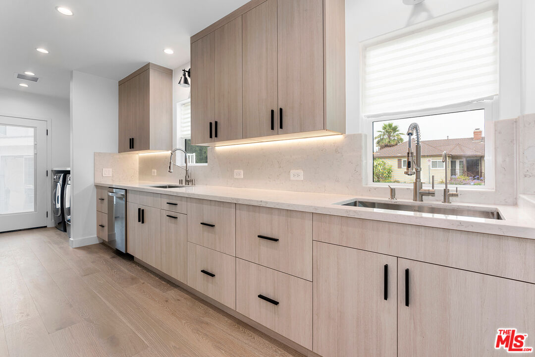1901 South Point View Street Los Angeles, CA 90034 - Photo 9 of 21 a bathroom with a double vanity sink and a mirror
