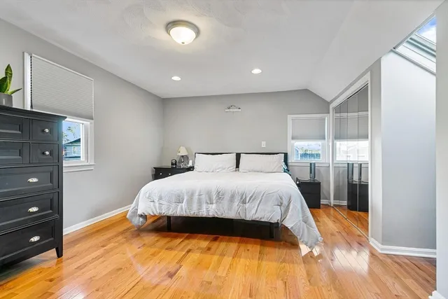 a bedroom with a bed and walk in closet