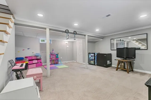 a bedroom with furniture and a gym equipment