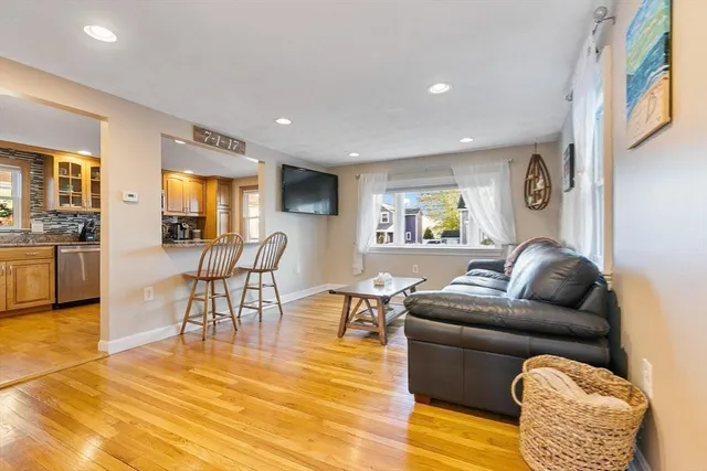 a kitchen with stainless steel appliances granite countertop sink stove top oven and refrigerator