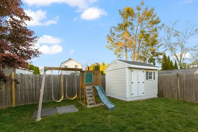 a view of a house with a backyard