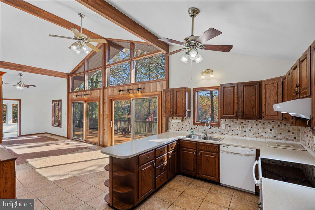 13140 Soundings Road Lusby, MD 20657 - Photo 13 of 81 a kitchen with a stove a sink and a refrigerator