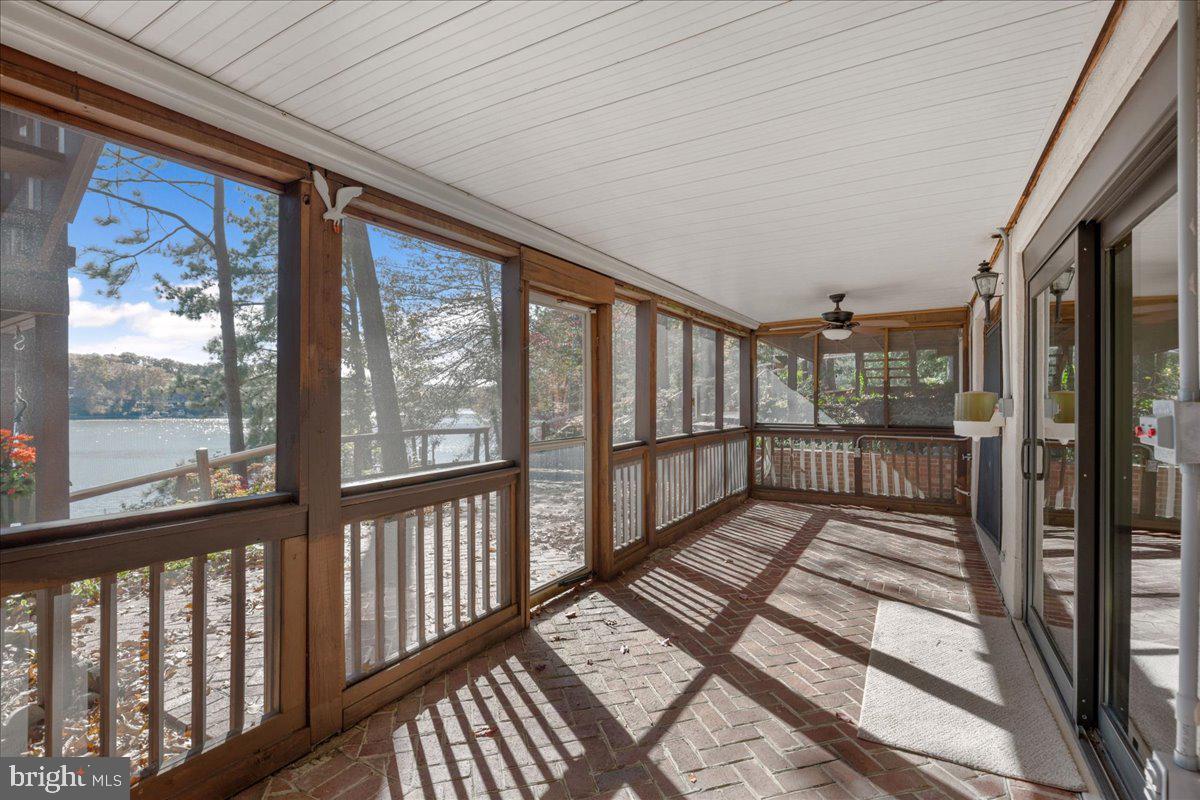 13140 Soundings Road Lusby, MD 20657 - Photo 65 of 81 a view of a porch with wooden floor