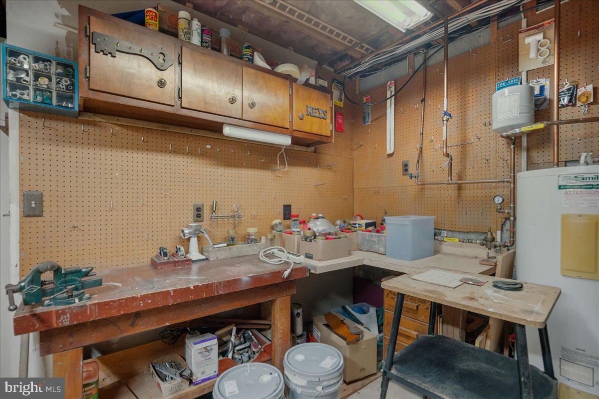 13140 Soundings Road Lusby, MD 20657 - Photo 74 of 81 a view of a kitchen with a table and chairs in it