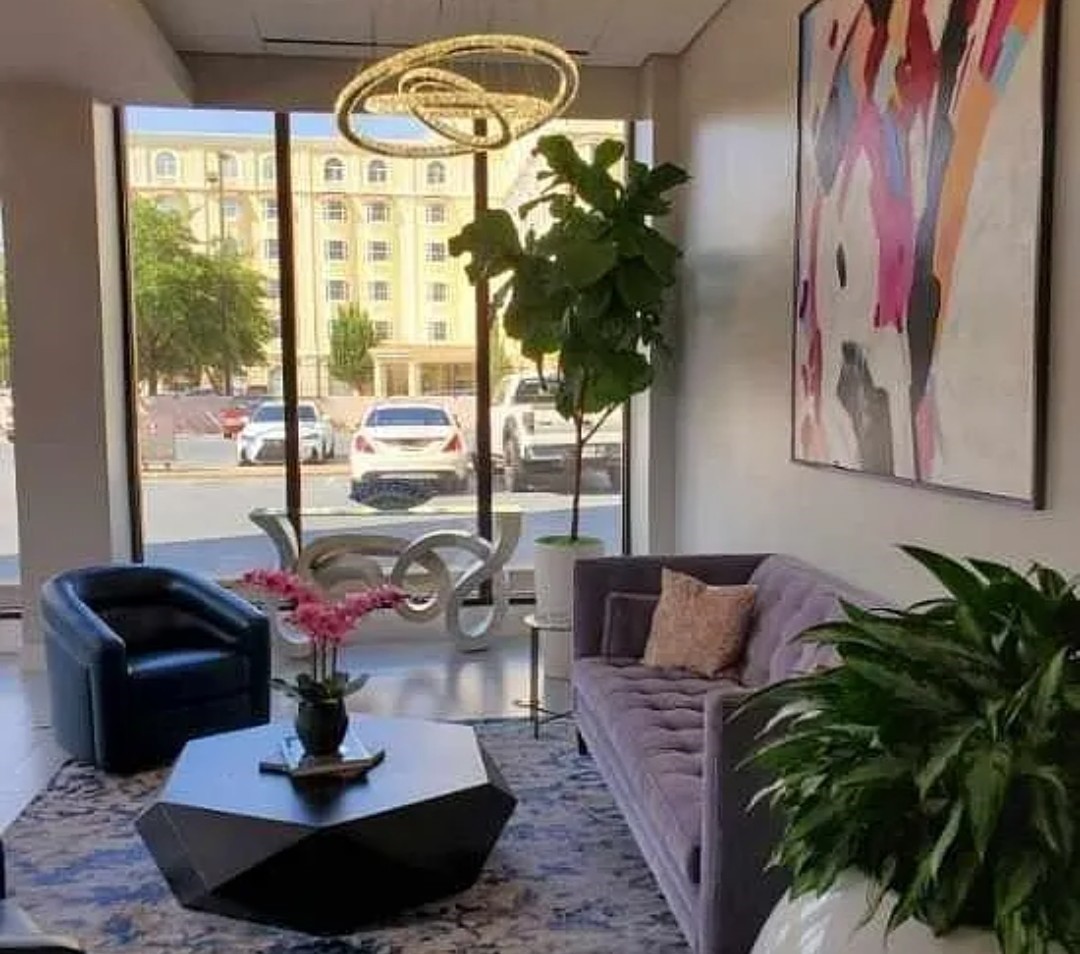 5150 Hidalgo Street, Unit 1503 Houston, TX 77056 - Photo 11 of 16 a living room with furniture flowerpot and a large window