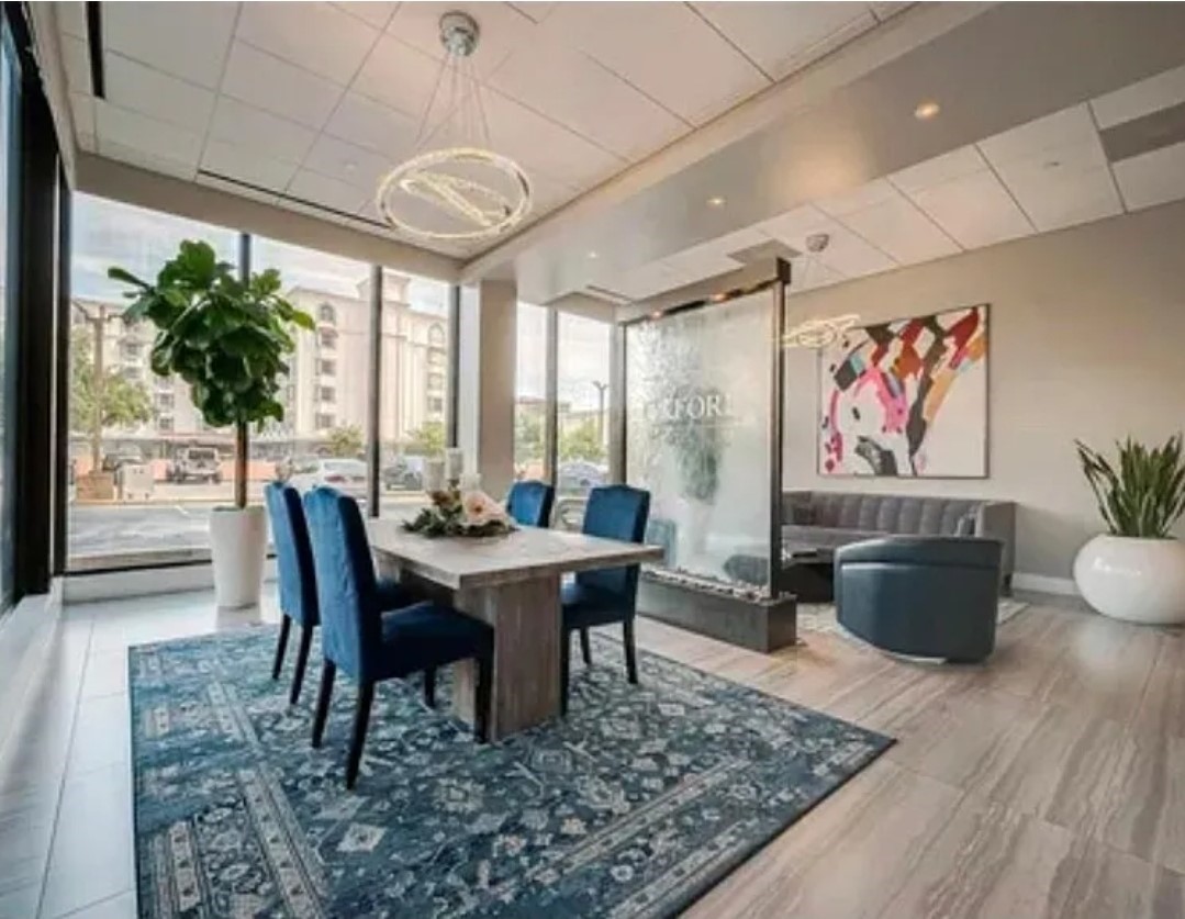 5150 Hidalgo Street, Unit 1503 Houston, TX 77056 - Photo 5 of 16 a view of a dining room with furniture window and wooden floor