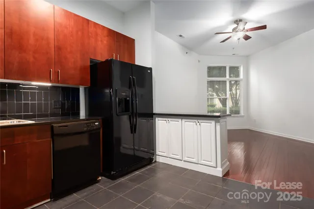 a kitchen with stainless steel appliances a refrigerator and a stove