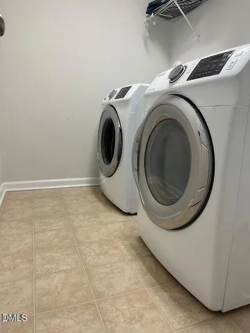 a bed sitting in a room next to a window