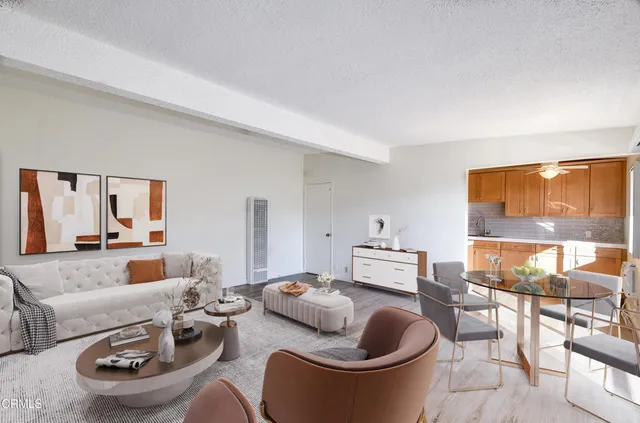 a living room with furniture and a floor to ceiling window