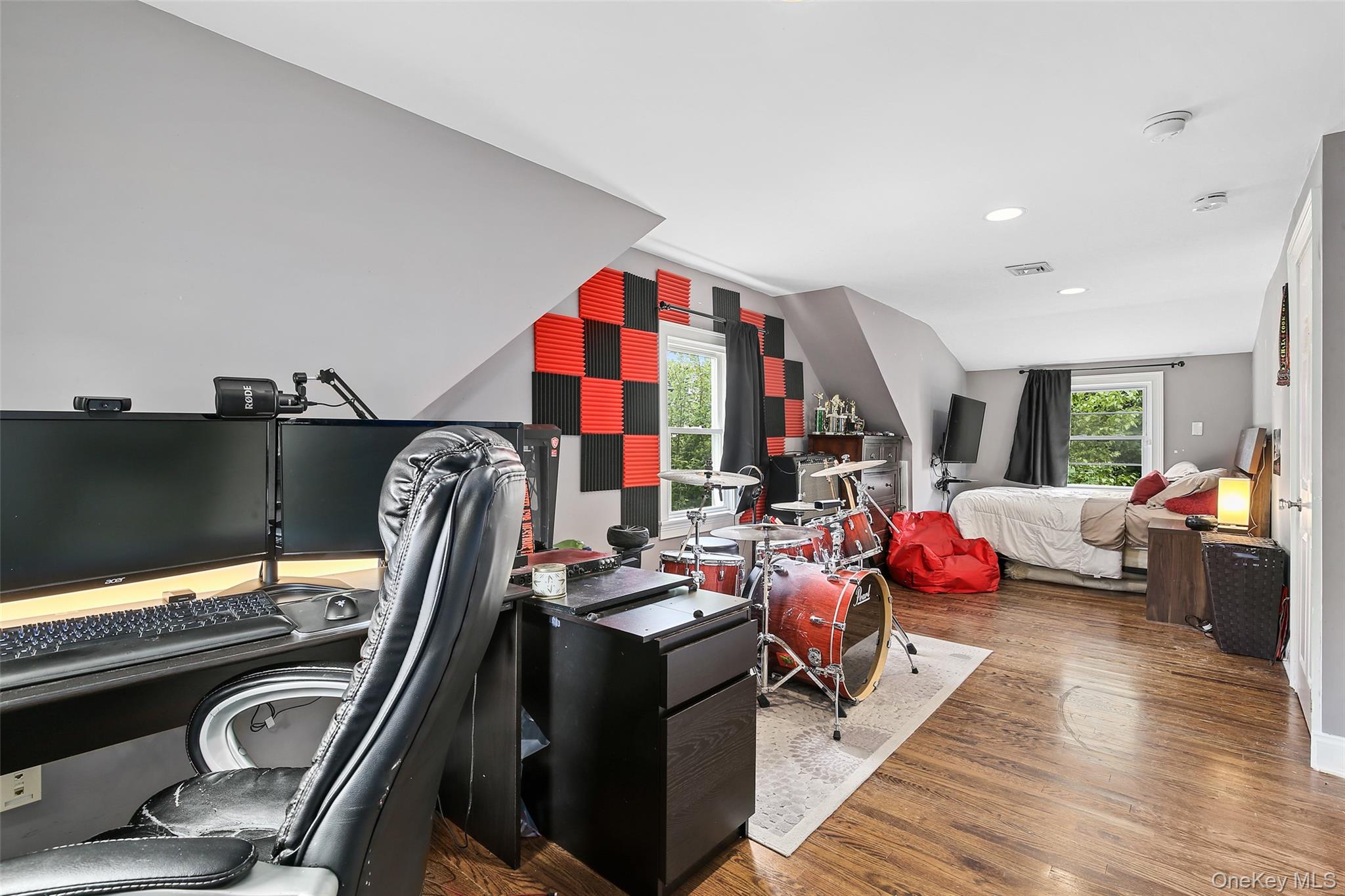 8 Goldwin Street Rye, NY 10580 - Photo 15 of 25 a living room with furniture a flat screen tv and a large window