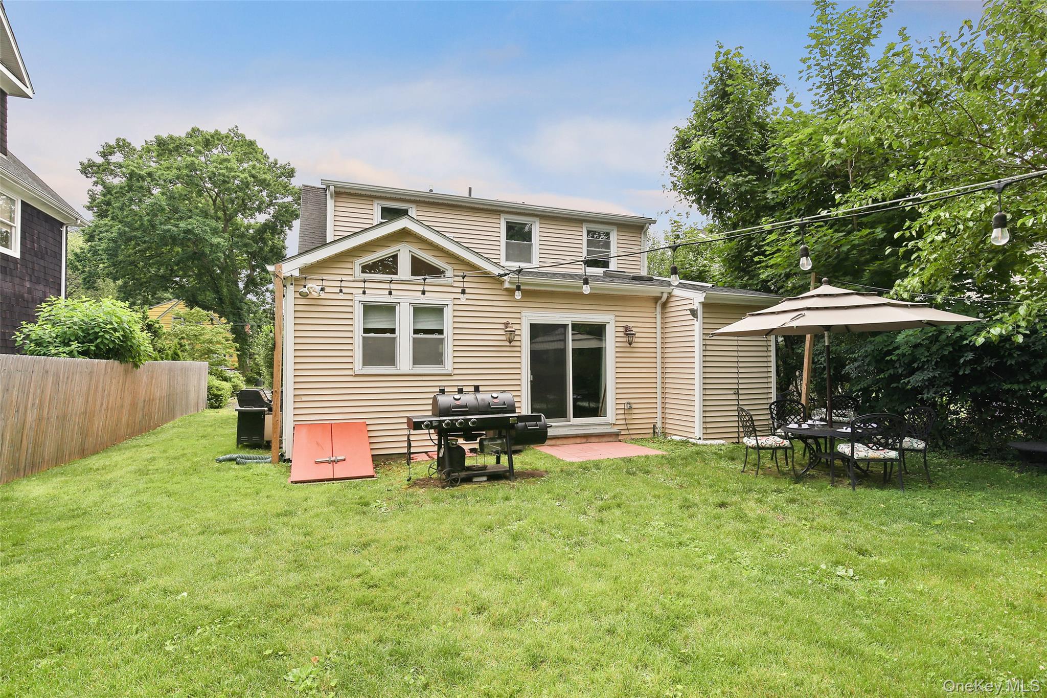 8 Goldwin Street Rye, NY 10580 - Photo 17 of 25 a front view of house with yard and outdoor seating