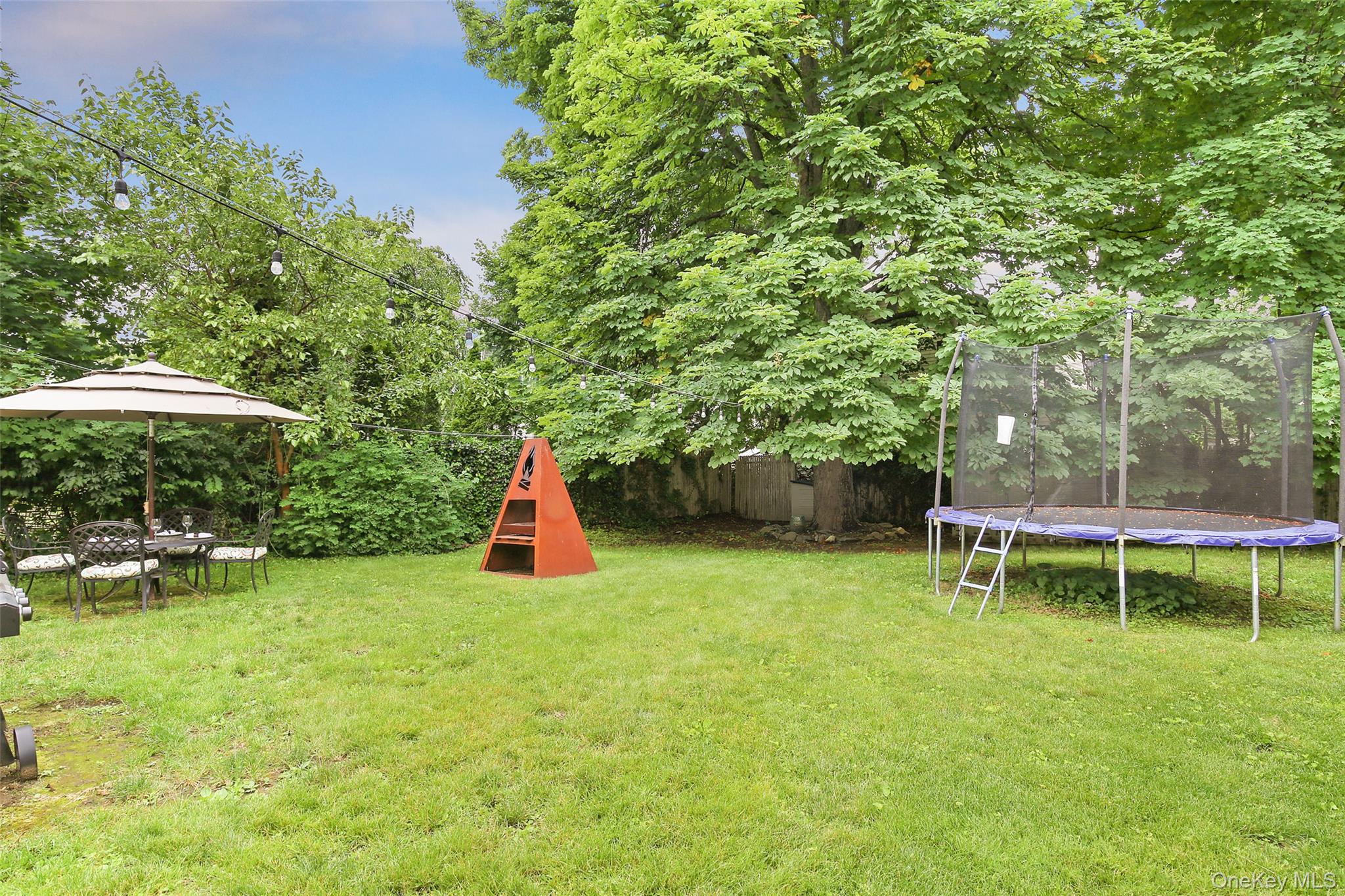 8 Goldwin Street Rye, NY 10580 - Photo 18 of 25 a view of a bench in a backyard