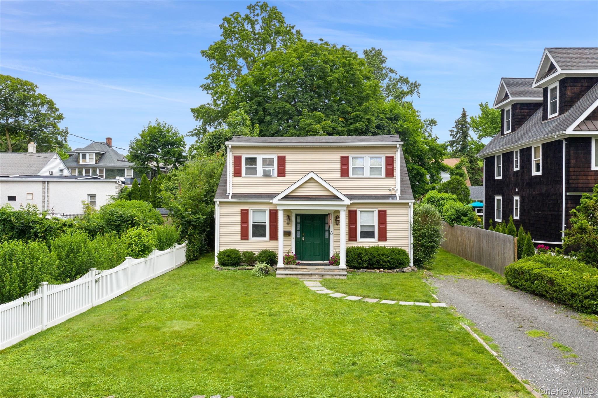 8 Goldwin Street Rye, NY 10580 - Photo 22 of 25 a front view of a house with garden