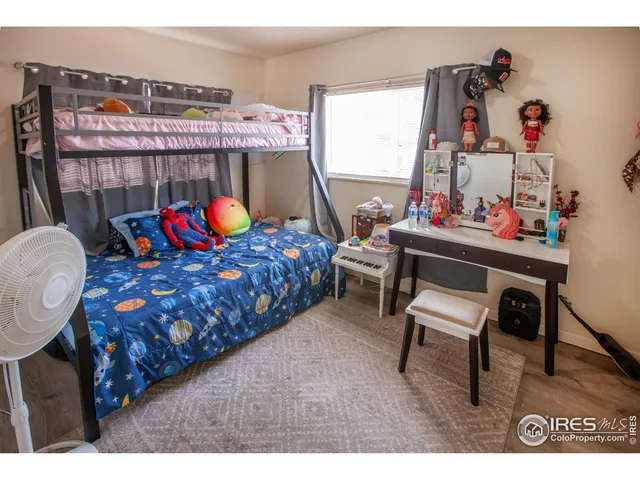 a bedroom with furniture and a bed