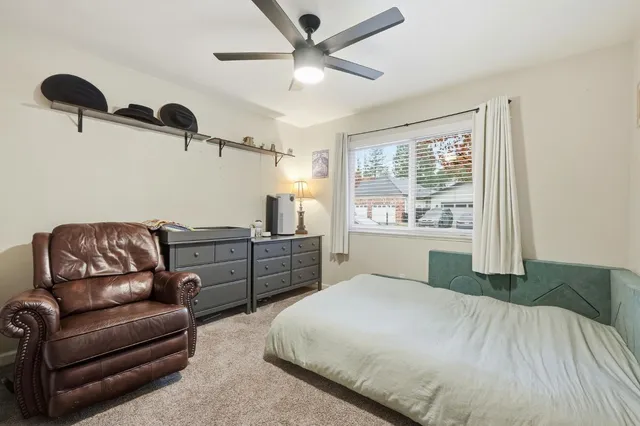 a view of a patio with a table and chairs and potted plants